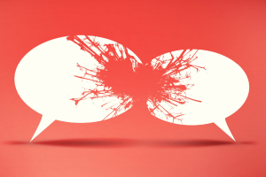 Two colliding speech bubbles; a violent red splatter indicates discord.