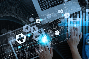 A medical professional engaged with a laptop, displaying various icons on the screen, indicating active digital interaction.