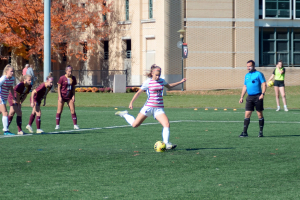 Helena Spencer playing on the soccer field