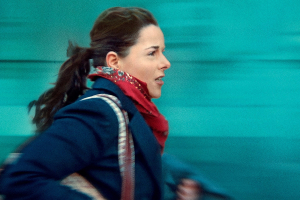 An image depicting Julie Roy (Laure Calamy) rushing to her next task in the film “Full Time.” credit: Music Box Films