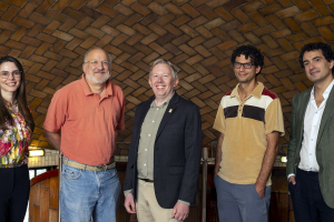 The core team behind the Institute for Complex Social Dynamics poses on the third floor of Baker Hall: Kara Kedrick, John Miller, Kevin Zollman, Russell Golman and Simon DeDeo (not pictured: Nynke Niezink and Cosma Shalizi)