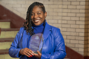 Teraya White holding an award