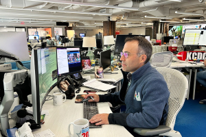 Eric Salzman sitting at a desk