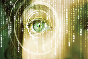 A person's eye with computer coding in the foreground